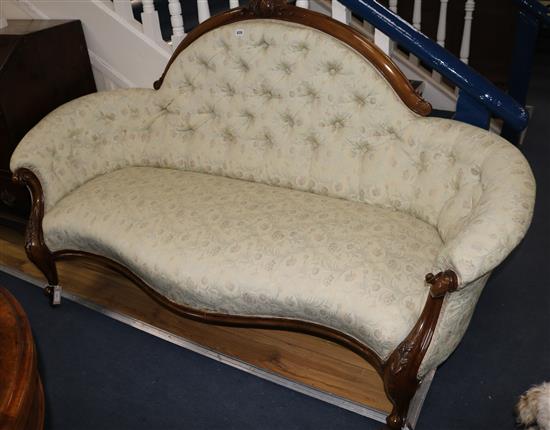 A Victorian carved walnut serpentine button back settee, W.180cm